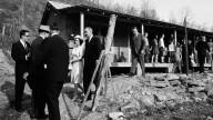 President Lyndon Johnson and his wife, Lady Bird, visit the Appalachian area in Eastern Kentucky to see conditions firsthand and announce his War on Poverty.