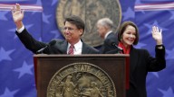 North Carolina Gov. Pat McCrory and his wife Ann greet the public prior to taking the oath of office during the inaugural ceremonies at the state capitol in Raleigh, NC, Saturday, Jan. 12, 2013. (AP Photo/Gerry Broome)