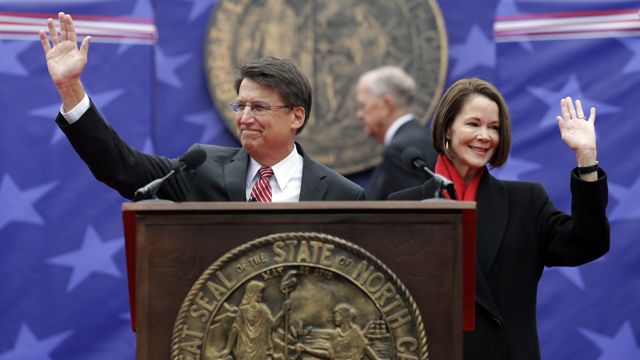 North Carolina Gov. Pat McCrory and his wife Ann greet the public prior to taking the oath of office during the inaugural ceremonies at the state capitol in Raleigh, NC, Saturday, Jan. 12, 2013. (AP Photo/Gerry Broome)