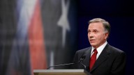 Former Rep. Tom Tancredo, R-Colo., responds during the Des Moines Register Republican Presidential Debate in Johnston, Iowa, Wednesday, Dec. 12, 2007. (AP Photo/Charlie Neibergall)