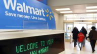In this Feb. 17, 2009 file photo, shoppers leave a Wal-Mart in Danvers, Mass. Wal-Mart Stores Inc., the world's largest retailer, on Thursday, Jan. 28, 2010 said it is realigning its U.S. operations in an effort to give more autonomy to executives in regional markets and reinvigorate U.S. growth.. (AP Photo/Lisa Poole, File)
