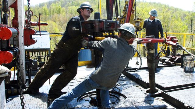 FILE - In this April 23, 2010 file photo, workers move a section of well casing into place at a Chesapeake Energy natural gas well site near Burlington, Pa., in Bradford County. So vast is the wealth of natural gas locked into dense rock deep beneath Pennsylvania, New York, West Virginia and Ohio that some geologists estimate it's enough to supply the entire East Coast for 50 years. But freeing it requires a powerful drilling process called hydraulic fracturing or "fracking,"using millions of gallons of water brewed with toxic chemicals that some fear threaten to pollute water above and below ground, deplete aquifers and perhaps endanger human health and the environment. (AP Photo/Ralph Wilson, File)