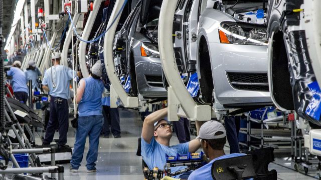 Workers assemble Volkswagen Passat sedans at the German automaker's plant in Chattanooga, Tenn. Workers at the plant will decide in a three-day vote Wednesday, Feb. 12, 2014, whether they want to be represented by the United Auto Workers union. (AP Photo/Erik Schelzig, file)