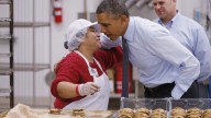 President Barack Obama greets an employee in the bakery at a Costco store in Lanham, Md. Wednesday, Jan. 29, 2014, where he spoke about raising the minimum wage the morning after his State of the Union address. (AP Photo/Charles Dharapak)