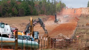 In this Dec. 3, 2012 file photo, crews work on construction of the TransCanada Keystone XL Pipeline near County Road 363 and County Road 357, east of Winona, Texas. (AP Photo/The Tyler Morning Telegraph, Sarah A. Miller)
