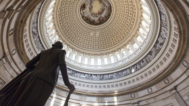 The Capitol Rotunda looms over the statue of George Washington on Capitol Hill in Washington, Monday, Jan. 27, 2014, as the House and Senate resume work in Washington. President Barack Obama will deliver his State of the Union address Tuesday night to a joint session of Congress. (AP Photo/J. Scott Applewhite)