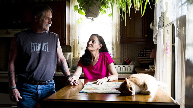 David and Barbara Ludwig pose for a portrait at their home Wednesday, May 28, 2014, in Reading, Pa. The Ludwigs lost their manufacturing jobs and have been struggling financially ever since. For decades, American manufacturing provided entrée to the middle class, especially for workers without college degrees. No more. Globalization, automation and recession destroyed nearly 6 million manufacturing jobs between 2000-2009, casting many displaced workers out of the middle class and, consequently, widening the income gap between rich and poor.  (AP Photo/Matt Rourke)