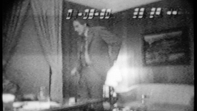 Photo from TV monitor shows Rep. Richard Kelly, R-Fla., standing and reaching to his back pocket as he was video taped during the FBI's AbSCAM investigation. The tape was released on Thursday, Dec. 12, 1980 in Washington. (AP Photo/ Charles Tasnadi)