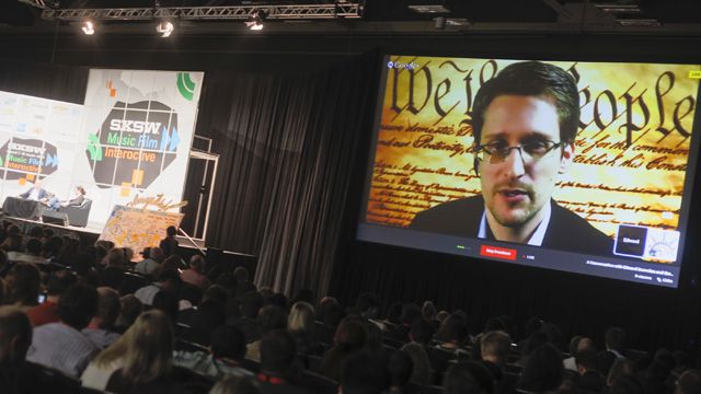 Edward Snowden talks during a simulcast conversation during the SXSW Interactive Festival on Monday, March 10, 2014, in Austin, Texas. Snowden talked with American Civil Liberties UnionÃ­s principal technologist Christopher Soghoian, and answered tweeted questions. (Photo by Jack Plunkett/Invision/AP)
