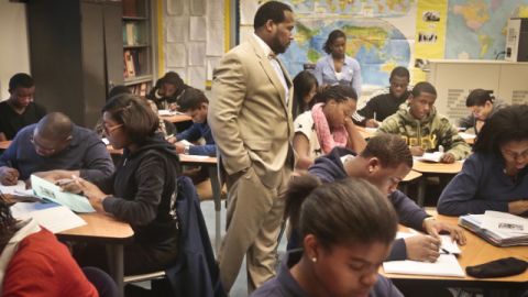 Adofo Muhammad, center, principal of Bedford Academy High School, teaches 10th and 11th graders in his Global Studies class in the Brooklyn Borough of New York. (AP Photo/Bebeto Matthews, File)