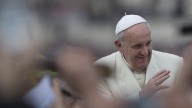 Pope Francis waves as he is driven through the crowd ahead of his weekly general audience in St. Peter's Square, at the Vatican, Wednesday, Feb. 26, 2014. (AP Photo/Felipe Dana)