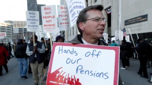 In this Oct. 23, 2013 file photo, Dennis Marton walks with protesters at a rally outside The Theodore Levin United States Courthouse in Detroit. (AP Photo/Paul Sancya, File)