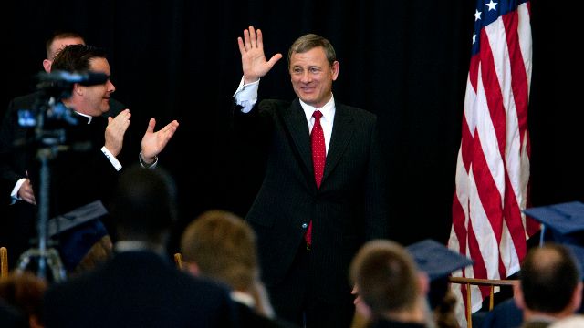 Supreme Court Chief Justice John Roberts waves after giving the commencement address on Friday, May 24, 2013, at LaLumiere School in LaPorte, Ind. (AP Photo/South Bend Tribune, James Brosher)