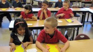 In this photo taken May 7, 2012, students in a kindergarten classroom at North Valley Academy in Gooding, Idaho wear red, white and blue shirts as part of their school uniform. The K-12th grade public charter school is the first in Idaho to advertise itself as a patriotic choice for parents, with an emphasis on individual freedoms and free-market capitalism. (AP Photo/Jessie L. Bonner)