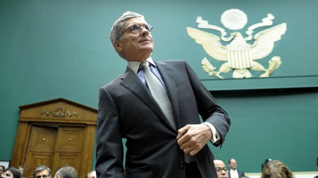 Federal Communications Commission (FCC) Chairman Tom Wheeler arrives on Capitol Hill in Washington, Thursday, Dec. 12, 2013, to testify before the House Energy and Commerce Committee hearing on cell phones on planes. (AP Photo/Susan Walsh)