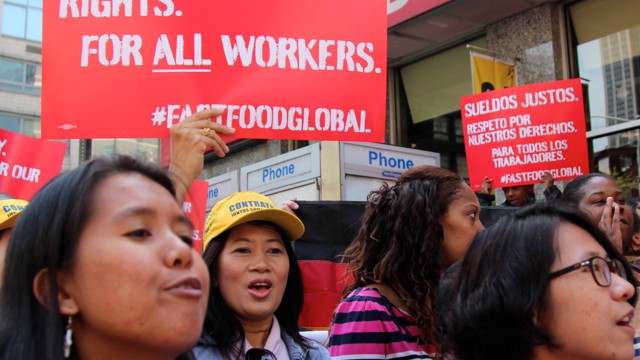 Fast food workers announce a global protest for a higher minimum wage outside a McDonald's restaurant in Manhattan on May 7, 2014. (BillMoyers.com/Neha Tara Mehta)