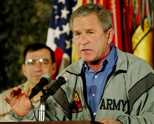 President George W. Bush speaks to US troops, Nov. 27, 2003, in Baghdad, Iraq. (AP Photo/Pablo Martinez Monsivais)