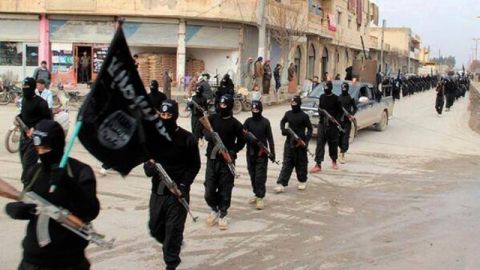 This undated file image posted on a militant website on Tuesday, Jan. 14, 2014 shows fighters from the Islamic State of Iraq and the Levant (ISIL) marching in Raqqa, Syria. (AP Photo/Militant Website, File)