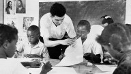 this Aug. 23, 1964 file photo, Bruce Solomon, of the Brooklyn borough of New York, teaches a class for young black students about arts, African American history and rights at a "Freedom School" in Jackson, Miss.