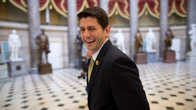 House Budget Committee Chairman Rep. Paul Ryan (R-WI) laughs as he walks to his office on Capitol Hill in Washington, Friday, Oct. 11, 2013. (AP Photo/ Evan Vucci)