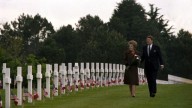 U.S. President Ronald Reagan and his wife, first lady Nancy Reagan, walk past the graves at Normandy American Cemetary in Normandy, France, June 6, 1984. The American president and first lady are attending the 40th anniversary of the allied invasion of 1944. (AP Photo/Ron Edmonds)