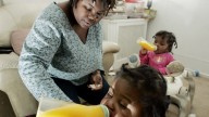 Tianna Gaines-Turner watches as her twin toddlers Marques, left, and Marianna Turner (at the time, both only one year old) have juice, Feb. 26, 2009, at their home in Philadelphia, PA. (AP Photo/Mel Evans)
