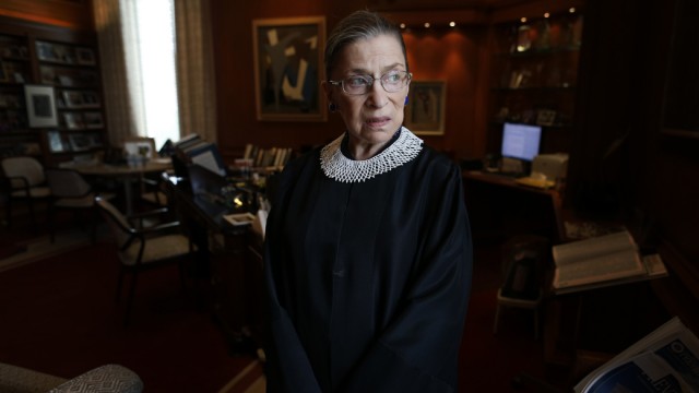 Justice Ruth Bader Ginsburg poses for a photo in her chambers at the Supreme Court in Washington, July 24, 2013. (AP Photo/Charles Dharapak)