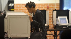A woman votes at Woodridge Elementary School in Stone Mountain, Ga., on Tuesday, May 20, 2014. Five major GOP candidates will square off to represent their party this fall in the election to replace retiring U.S. Sen. Saxby Chambliss. Meanwhile, Michelle Nunn, daughter of former U.S. Sen. Sam Nunn is a heavy favorite to win the Democratic nomination. (AP Photo/Atlanta Journal-Constitution, Kent D. Johnson)