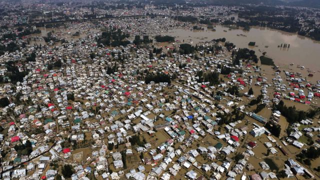 An aerial view showing buildings partially submerged in Srinagar, Indian-controlled Kashmir, Wednesday, Sept.10, 2014. Raging monsoon floods sweeping across India and Pakistan have killed more than 440 people, authorities said Tuesday, warning hundreds of thousands more to be prepared to flee their homes as helicopters and boats raced to save marooned victims.(AP Photo/Dar Yasin)