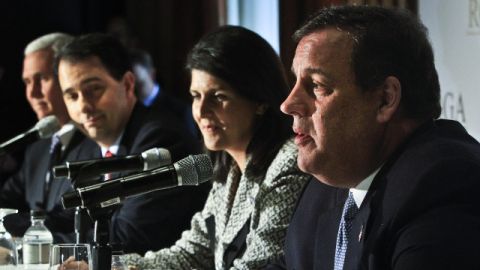 Indiana Gov. Mike Pence, far left, Wisconsin Gov. Scott Walker, second from left, South Carolina Gov. Nikki R. Haley, second from right, listens as New Jersey Gov. Chris Christie, far right, speaks during a news conference at the Republican Governors Association's quarterly meeting on Wednesday May 21, 2014 in New York. (AP Photo/Bebeto Matthews)