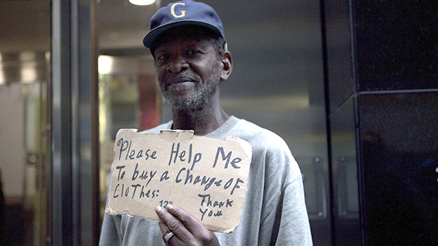 A homeless man standing outside of McDonald's in Wall St.(Credit: Charina Nadura/Moyers & Company)