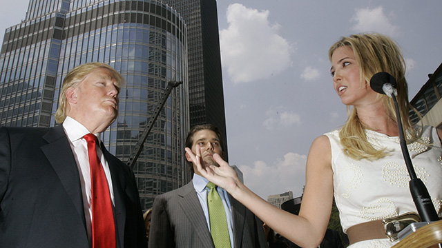 Real estate mogul Donald Trump, left, with his kids Donald Trump Jr., center, and daughter Ivanka, right, in front of the 92-story Trump International hotel and Tower in May 2007. (AP Photo/Charles Rex Arbogast) 