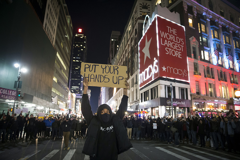 Protestors occupy Herald Square during a march Thursday, Dec. 4, 2014, in New York, against a grand jury's decision not to indict the police officer involved in the death of Eric Garner. (AP Photo/John Minchillo)