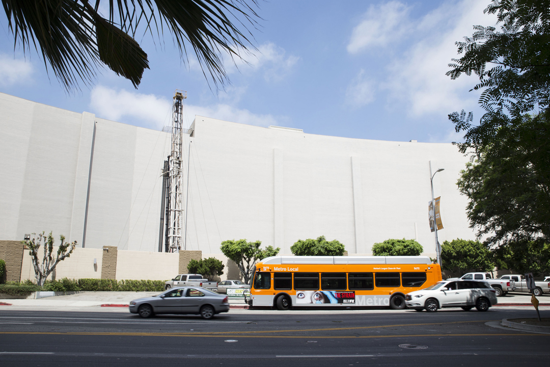 An oil rig is hidden behind the back of the Beverly Center, a huge shopping mall in Beverly Hills, L.A. Rigs like these are scattered throughout the city. 
