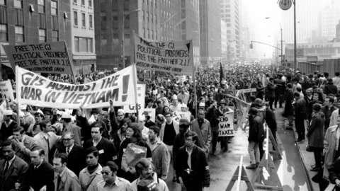 Thousands of anti-Vietnam war protesters march along the Avenue of the America's on 6th Avenue in New York City on April 5, 1969. Many of the protesters wore black arm bands bearing the number "33,000," referring to the American deaths in Vietnam. (AP Photo)
