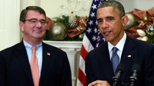 President Barack Obama speaks as Ashton Carter, his nominee for defense secretary, listens during the announcement, Friday, Dec. 5, 2014, in the Roosevelt Room of the White House in Washington. (AP Photo/Susan Walsh)