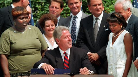President Clinton signing the "welfare-to-work" act in 1996.