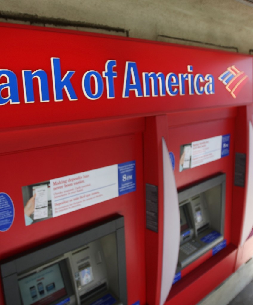 A man uses an ATM at a Bank of America branch on July 28, 2009 in Pasadena, California. (Photo by David McNew/Getty Images)