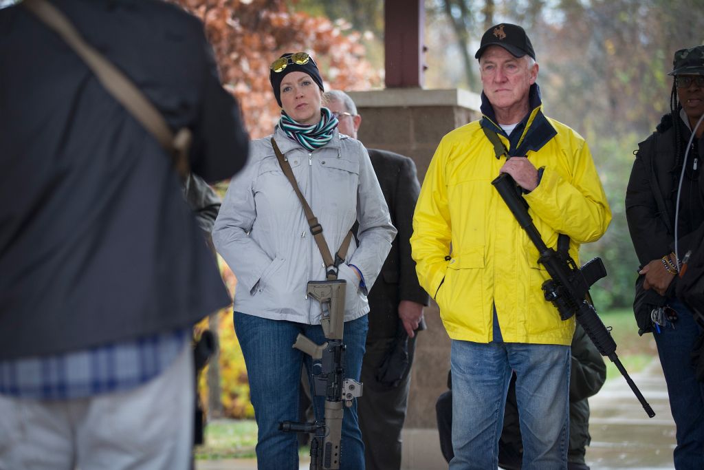 FERGUSON, MO - NOVEMBER 16:  Gun rights activists gather at a public pavilion prior to a march to the Ferguson Police station on November 16, 2015 in Ferguson, Missouri. About a dozen activists marched in the demonstration to educate Ferguson residents about their rights as gun owners. Residents of Missouri are permitted to carry firearms in the open in public.  (Photo by Scott Olson/Getty Images)