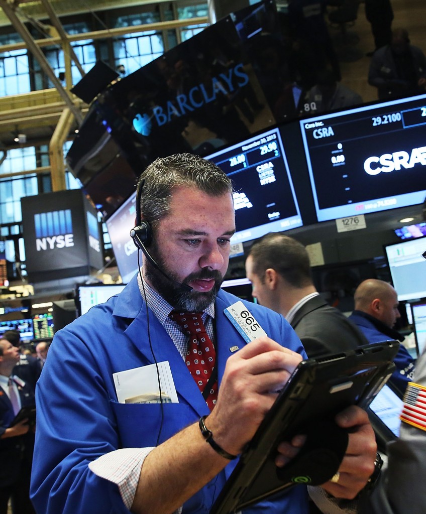 Traders work on the floor of the New York Stock Exchange (NYSE) on November 30, 2015 in New York City. (Photo by Spencer Platt/Getty Images)