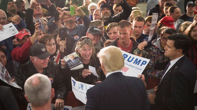 Republican presidential candidate Donald Trump greets guests at a campaign event at Mississippi Valley Fairgrounds on December 5, 2015 in Davenport, Iowa. Trump continues to lead the most polls in the race for the Republican nomination for president. (Photo by Scott Olson/Getty Images)