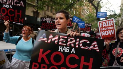 Activists hold a protest near the Manhattan apartment of billionaire and Republican financier David Koch on June 5, 2014 in New York City. The demonstrators were protesting against the campaign contributions by the billionaire Koch brothers who are owners of Koch Industries Inc. The brothers have become a focus of Democrats and liberals as they are accused of skewing the political playing field with their finances. (Photo by Spencer Platt/Getty Images)
