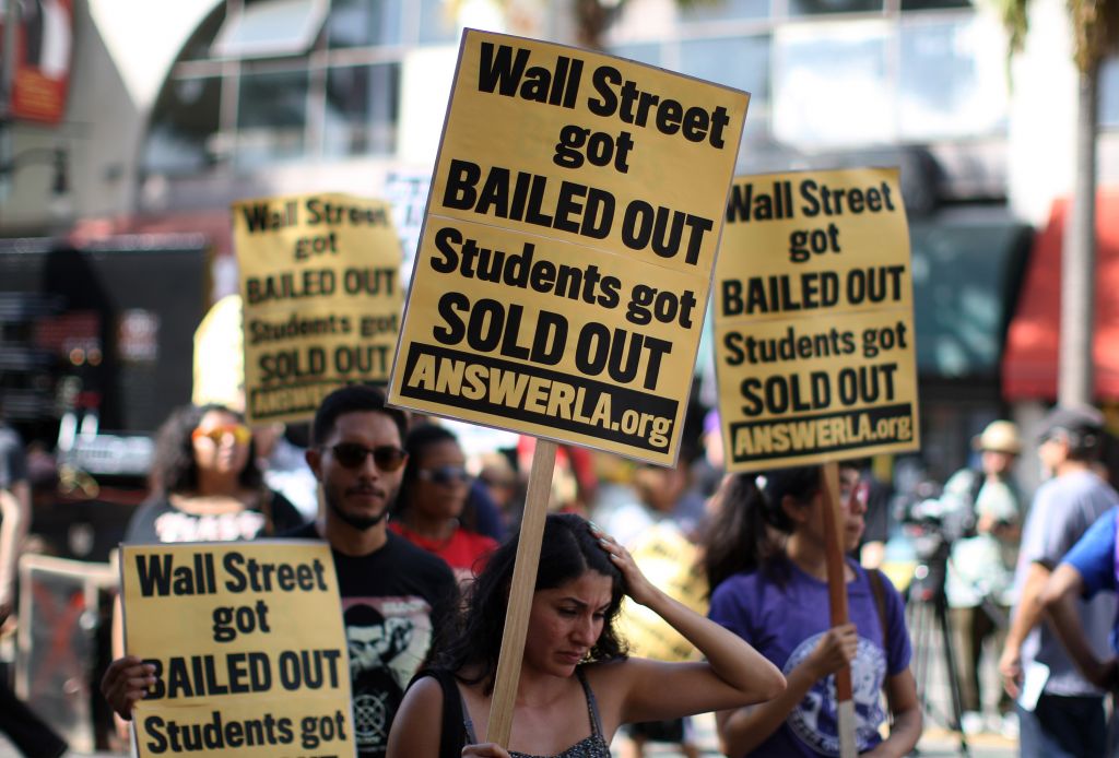 Students protest the rising costs of student loans for higher education on Hollywood Boulevard in 2012. (Photo by David McNew/Getty Images)