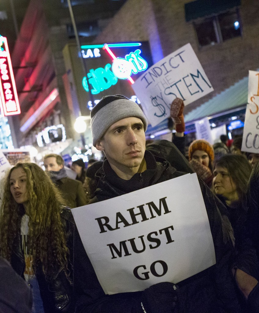 CHICAGO, IL - DECEMBER 18: Demonstrators calling for the resignation of Chicago Mayor Rahm Emanuel march through downtown on December 18, 2015 in Chicago, Illinois. A recently released video showing the shooting of teenager Laquan McDonald by Chicago Police officer Jason Van Dyke has sparked almost daily protests in the city. Demonstrators have accused Emanuel of trying to cover up the circumstances surrounding the shooting. (Photo by Scott Olson/Getty Images)