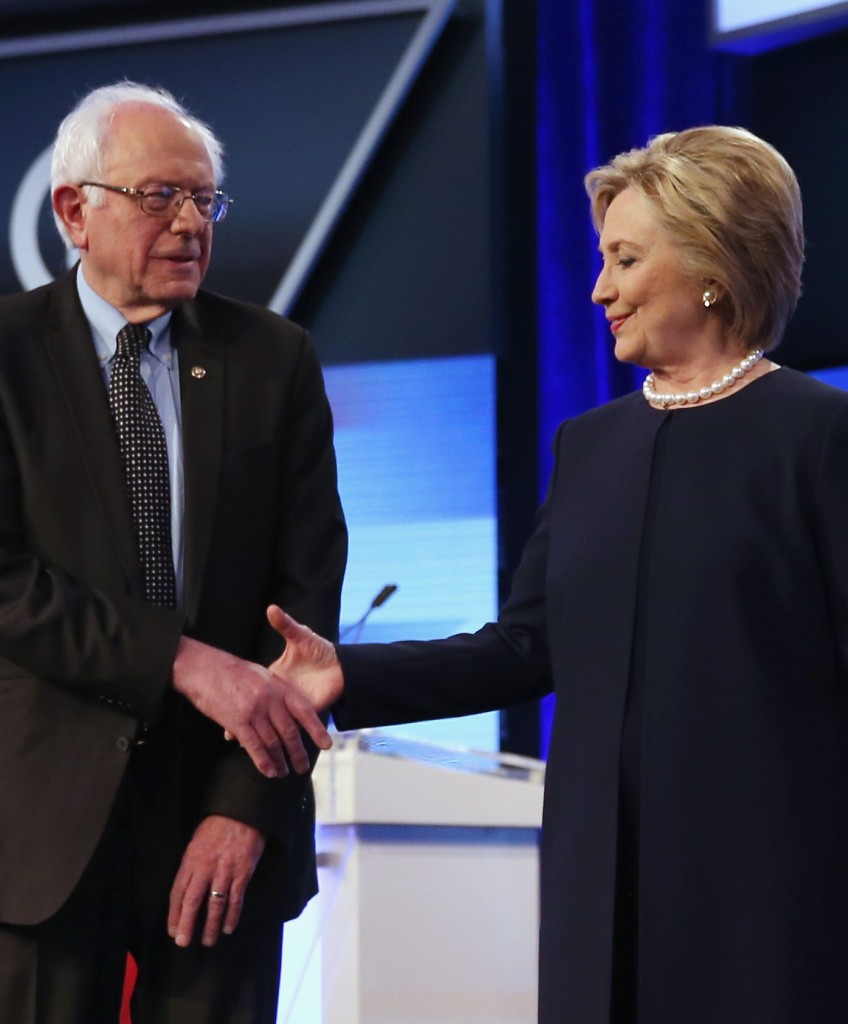 MIAMI, FL - MARCH 09: Democratic presidential candidates Senator Bernie Sanders (D-VT) and Democratic presidential candidate Hillary Clinton shake hands before the Univision News and Washington Post Democratic Presidential Primary Debate on the Miami Dade Colleges Kendall Campus on March 9, 2016 in Miami, Florida. Voters in Florida will go to the polls March 15th for the state's primary. (Photo by Joe Raedle/Getty Images)
