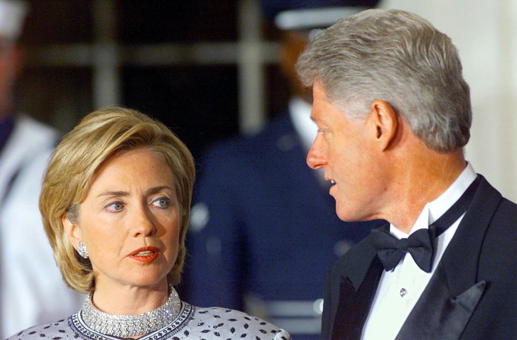 President Bill Clinton and First Lady Hillary Clinton talk prior to the arrival of Czech Republic President Vaclav Havel for the official State Dinner at the White House in Washington, DC, September 16, 1998. (Stephen Jaffe/AFP/Getty Images)