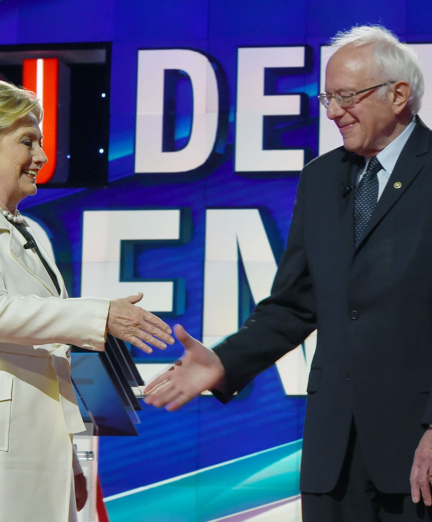 US Democratic presidential candidates Hillary Clinton (L) and Bernie Sanders shake hands before the CNN Democratic Presidential Debate at the Brooklyn Navy Yar on April 14, 2016, in New York. Hillary Clinton and Bernie Sanders take their increasingly acrimonious battle for the Democratic White House nomination to a debate stage in Brooklyn ahead of the key New York primary. / AFP / Jewel SAMAD (Photo credit should read JEWEL SAMAD/AFP/Getty Images)