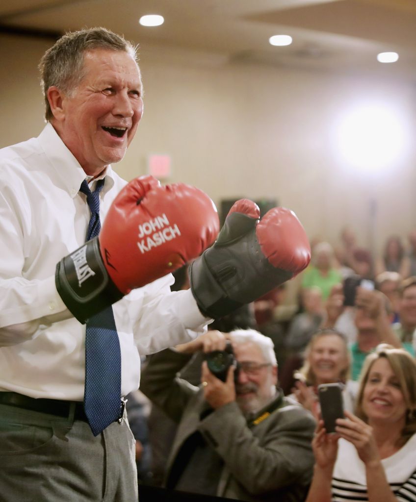 ANNAPOLIS, MD - APRIL 19: Republican presidential candidate John Kasich puts on a pair of boxing gloves given to him by a supporter during a campaign town hall meeting in the ballroom at a Crowne Plaza hotel April 19, 2016 in Annapolis, MD. Voters are going to the polls in the New York primary election today where Kasich and his fellow candidate Sen. Ted Cruz (R-TX) are hoping to keep their rival for the nomination Donald Trump from winning all 95 of that state's delegates. (Photo by Chip Somodevilla/Getty Images)