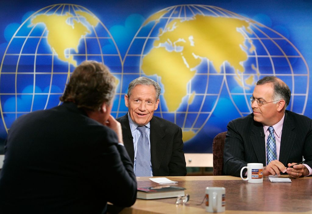 WASHINGTON - JULY 22: (AFP OUT) Washington Post Assistant Managing Editor Bob Woodward (C) speaks as New York Times columnist David Brooks (R) and moderator Tim Russert (L) look on during a taping of "Meet the Press" at the NBC studios July 22, 2007 in Washington, DC. Woodward and Brooks spoke on various topics including the current situation of the war in Iraq. (Photo by Alex Wong/Getty Images for Meet the Press)