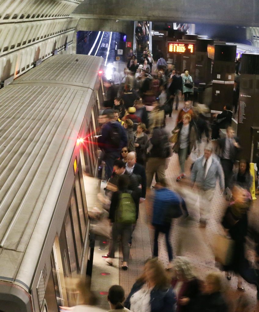 Commuters board a Metrorail train at Union Station in Washington, DC, on March 15, 2016. Metrorail shut down service entirely for emergency inspections of the system's third-rail power cables after a tunnel fire. (Photo by Mark Wilson/Getty Images)